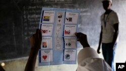 FILE - Election officials start counting the ballots after polls closed in the presidential elections in Bujumbura, Burundi, July 21, 2015. 