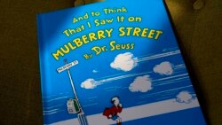 FILE - A copy of the book "And to Think That I Saw It on Mulberry Street," by Dr. Seuss, rests in a chair, Monday, March 1, 2021, in Walpole, Mass. (AP Photo/Steven Senne)
