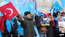 Uighurs living in Turkey stage a demonstration to commemorate the anniversary of the deadly ethnic unrests of 1997 in Gulja, China's far-western Xinjiang Uighur Autonomous Region, in Ankara on Feb. 5, 2020. 