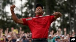 Tiger Woods reacts as he wins the Masters golf tournament Sunday, April 14, 2019, in Augusta, Ga. 