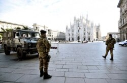 Military personnel are seen on Duomo square after the Italian government imposed a virtual lockdown on the north of the country, in Milan, March 8, 2020.