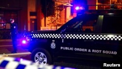 A policeman stands on a street blocked to the public after Australian counter-terrorism police arrested four people in raids across several Sydney suburbs in Australia, July 29, 2017.