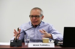 FILE - Sean Turnell discusses economic reforms by Myanmar's NLD government at a seminar in Singapore, May 2018. (ISEAS-Yusof Ishak Institute/via Reuters)