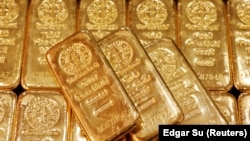 FILE - Gold bullions are displayed at GoldSilver Central's office in Singapore June 19, 2017. 