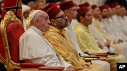 Pope Francis sits next to King Mohammed VI at the diocesan Caritas center in Rabat, Morocco, March 30, 2019.