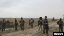 Afghan National Army (ANA) soldiers arrive at the site of last night clashes between Taliban and Afghan forces in Kunduz, Afghanistan, March 4, 2020. 