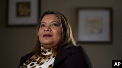 Irma Chavez poses for a photo, Tuesday, March 9, 2021, in Springdale, Ark. Chavez came to the United States from her home in El Salvador in 1994 when she was 18 and later was granted temporary protected status. (AP Photo/Jeff Roberson)