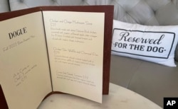 A menu for a multi-course menu is displayed at the Dogue restaurant for dogs in San Francisco, Sunday, Oct. 25, 2022. (AP Photo/Haven Daley)