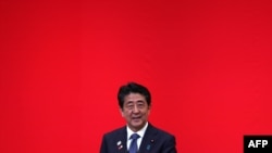 FILE - Japan's Prime Minister Shinzo Abe delivers a speech in Tokyo, July 24, 2019. 
