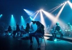 People attend a sit-down "corona-proof" dance event amid the coronavirus disease outbreak in Nijmegen, Netherlands, June 6, 2020.