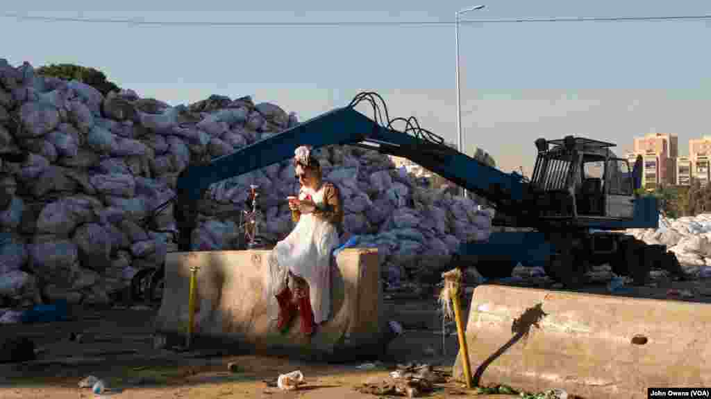 At a dump site on the outskirts of Beirut, Clown Me in sought to raise awareness to Lebanon's trash crisis by filming a Valentine's Day video, which it will post online. Sara Berjawi, who goes by the clown name Ziza, prepares.