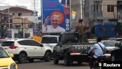 A billboard of Pope Francis is displayed a day ahead of his arrival in Kinshasa, Democratic Republic of Congo Jan. 30, 2023. 