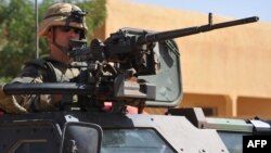 French troops patrol in the streets of Gao on February 3, 2013 as France jets carried out major air strikes today near Kidal.