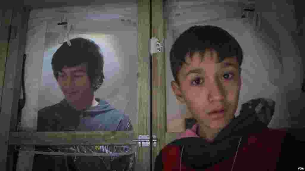 Two youngsters in a tent in Schisto camp. It is expected that the tents in this camp will be replaced by containers in the coming weeks. (J. Owens for VOA)