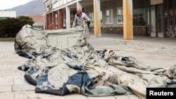A worker prepares an inflatable decoy of a military vehicle, which is used to confuse enemy attacks, during a media presentation in Decin, Czech Republic, March 6, 2023.