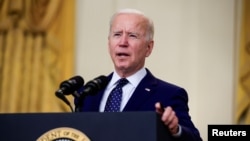 FILE - U.S. President Joe Biden delivers remarks on Russia in the East Room at the White House in Washington, April 15, 2021. 
