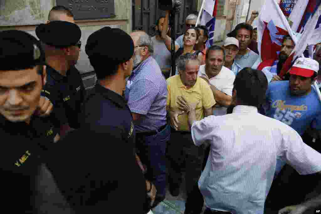 Greece braced for more chaos on the streets outside of shuttered banks as Athens and its creditors halted talks on resolving the country&#39;s deepening financial crisis until a referendum this weekend, July 3, 2015.