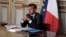 FILE - French President Emmanuel Macron is seen during a video conference at the Elysee Palace in Paris, May 18, 2020.