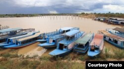 Boats for taking tourists to nearby Tonle Sap lake anchor inside Sou Jing Company development site in Siem Reap province, August 11, 2021. (Photo provided by So Rosa)