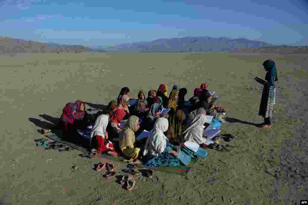 Afghan school children attend an open-air school at the Gambiri Refugee Camp in Laghman province.