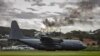 A Royal New Zealand Air Force C-130 Hercules aircraft lands to evacuate people at the airport in Noumea, New Caledonia, on May 21, 2024. (Australian Department of Defense via AFP)