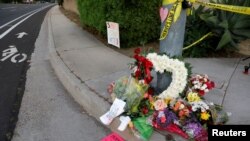 A makeshift memorial was placed by a light pole a block away from a shooting incident where one person was killed at the Congregation Chabad synagogue in Poway, north of San Diego, California, Apr. 27, 2019. 