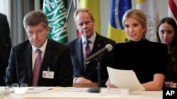 Ivanka Trump, right, speaks during a session on action to end forced labor, modern slavery and human trafficking as Guy Ryder, left, director general of the International Labor Organization listens, during the United Nations General Assembly, Sept. 19, 2017, at U.N. headquarters.
