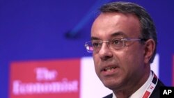 FILE - Christos Staikouras, Greece's Finance Minister, speaks at a financial conference in Lagonisi, south of Athens, July 16, 2019. 