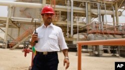 An Iranian worker in the partially constructed site which is part of South Pars gas field, in Assalouyeh, Iran, July 19, 2010. (AP Photo/Vahid Salemi)