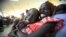 South Sudanese waiting to be flown back to their country sit at Khartoum Airport May 14, 2012. 
