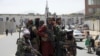 Taliban fighters patrol in Kabul, Afghanistan, Aug. 19, 2021, as senior members of the Haqqani Network, a group with a long-standing association with al-Qaida, is being put in charge of security in the Afghan capital.