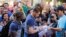 France's player Morgan Schneiderlin signs autographs for fans ahead of a press conference at the Teatro Pedro II in Ribeirao Preto, Brazil, Friday, June 27, 2014.