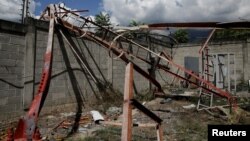 A fallen antenna is shown at a vandalized Movistar facility in Guarenas, Venezuela, Nov. 23, 2016. Movistar, the country's second largest telecom company, has suffered 636 thefts this year. 