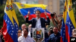 Juan Guaido, head of Venezuela's opposition-run congress, declares himself interim president of the nation until elections can be held during a rally demanding President Nicolas Maduro's resignation in Caracas, Venezuela, Jan. 23, 2019.
