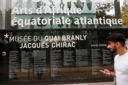 A man walks past The Quai Branly museum in Paris, Oct. 18, 2017. The musee du Quai Branly-Jacques Chirac is a museum featuring the indigenous art and cultures of Africa, Asia, Oceania, and the Americas.