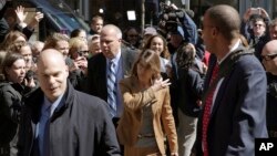Fans photograph actress Lori Loughlin as she arrives at federal court in Boston, April 3, 2019, to face charges in a nationwide college admissions bribery scandal.