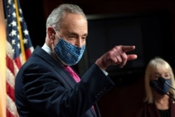 Senate Majority Leader Chuck Schumer of N.Y., left, speaks during a news conference with Sen. Patty Murray, D-Wash., Jan. 26, 2021, on Capitol Hill in Washington.