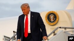 President Donald Trump steps off Air Force One at Morristown Municipal Airport in Morristown, N.J., July 24, 2020. 