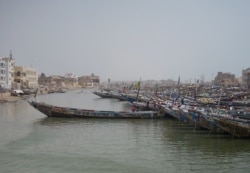 FILE - Fishing boats are seen in Saint-Louis, Senegal, May 16, 2020.