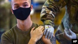 FILE - Hickam 15th Medical Group hosts the first COVID-19 mass vaccination on Joint Base Pearl Harbor-Hickam, Feb. 9, 2021, in this photo provided by the Department of Defense. 