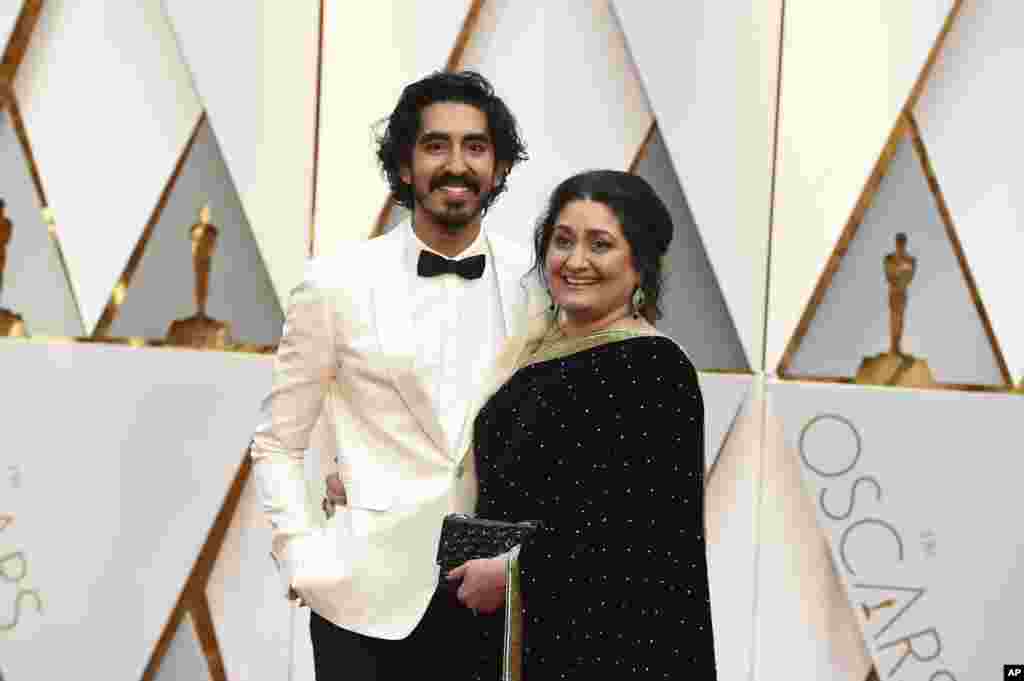 Dev Patel, left, and Anita Patel arrive at the Oscars on Feb. 26, 2017, at the Dolby Theatre in Los Angeles. 