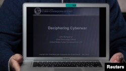 French urban climber, Alain Robert, also known as "French Spiderman", right, scales the 145 meters of the Agbar tower with the La Sagrada Familia Basilica designed by architect Antoni Gaudi in the background.