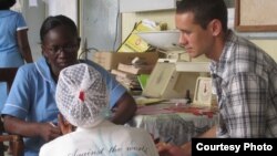  A woman receives information on postpartum depression at Komfo Anokye Teaching Hospital in Kumasi, Ghana. (Credit: K. Gold, University of Michigan medical School) 