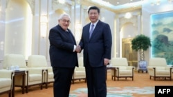 中国国家主席习近平2015年3月在北京会见前美国国务卿亨利·基辛格。（法新社）