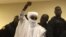 Chad's former dictator Hissene Habre raises his hand during court proceedings in Dakar, Senegal, May 30, 2016. 