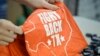 A volunteer stocks a table with shirts during a media tour of the Whole Woman’s Health clinic in San Antonio, Texas, Feb. 9, 2016. The group has launched a campaign to win support to keep its clinics open.