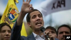 Venezuela's self-declared interim leader Juan Guaido speaks to supporters in a public plaza in Las Mercedes neighborhood of Caracas, Venezuela, Jan. 26, 2019.