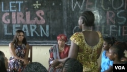 Michelle Obama spoke to school girls and women during her visit to Liberia last summer. Seated next to her is Liberian President Ellen Johnson Sirleaf. (Credit: )