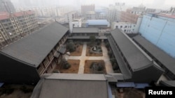 FILE - An unfinished residence which belongs to former People's Liberation Army (PLA) General Gu Junshan is pictured in Puyang, Henan province, January 19, 2014. 