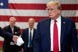 President Donald Trump participates in a tour of a Honeywell International plant that manufactures personal protective equipment, in Phoenix, May 5, 2020.